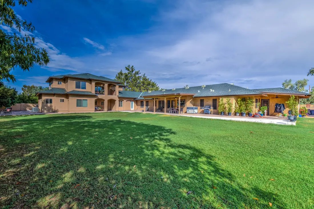 The lawn and mature trees on the Solstave property in Mesa, Arizona